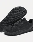 Dannto black barefoot outdoor sneakers shown from a three quarter view and the bottom