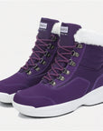 two Dannto women‘s purple winter snow Boots shown at a side angle