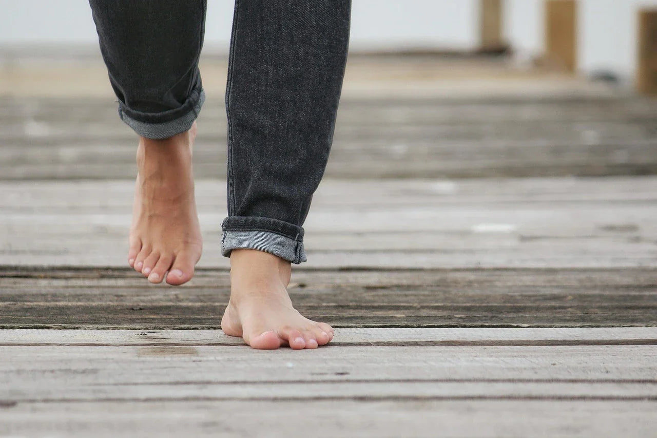barefoot walking on wooden dock showcasing natural movement