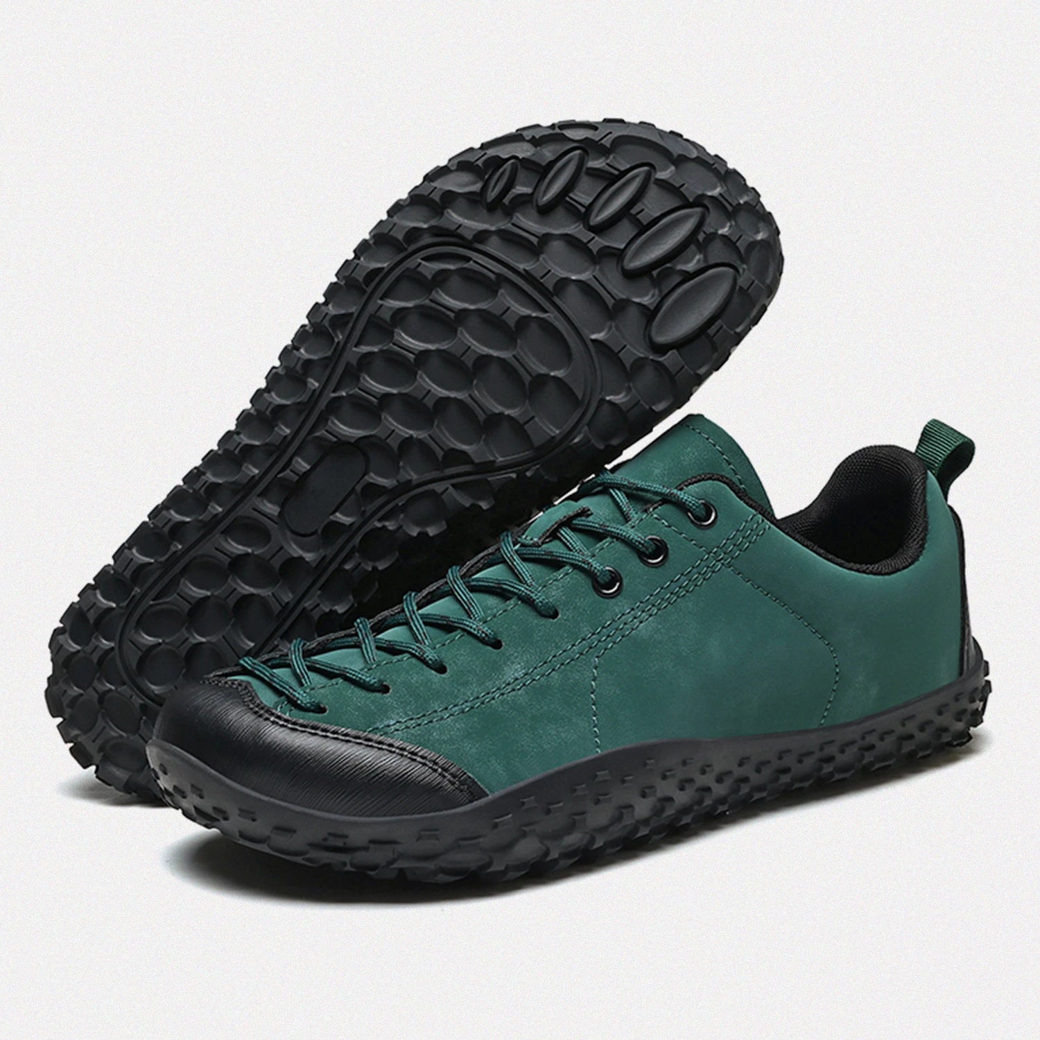 Dannto green barefoot trail shoes shown from a three quarter view and the bottom