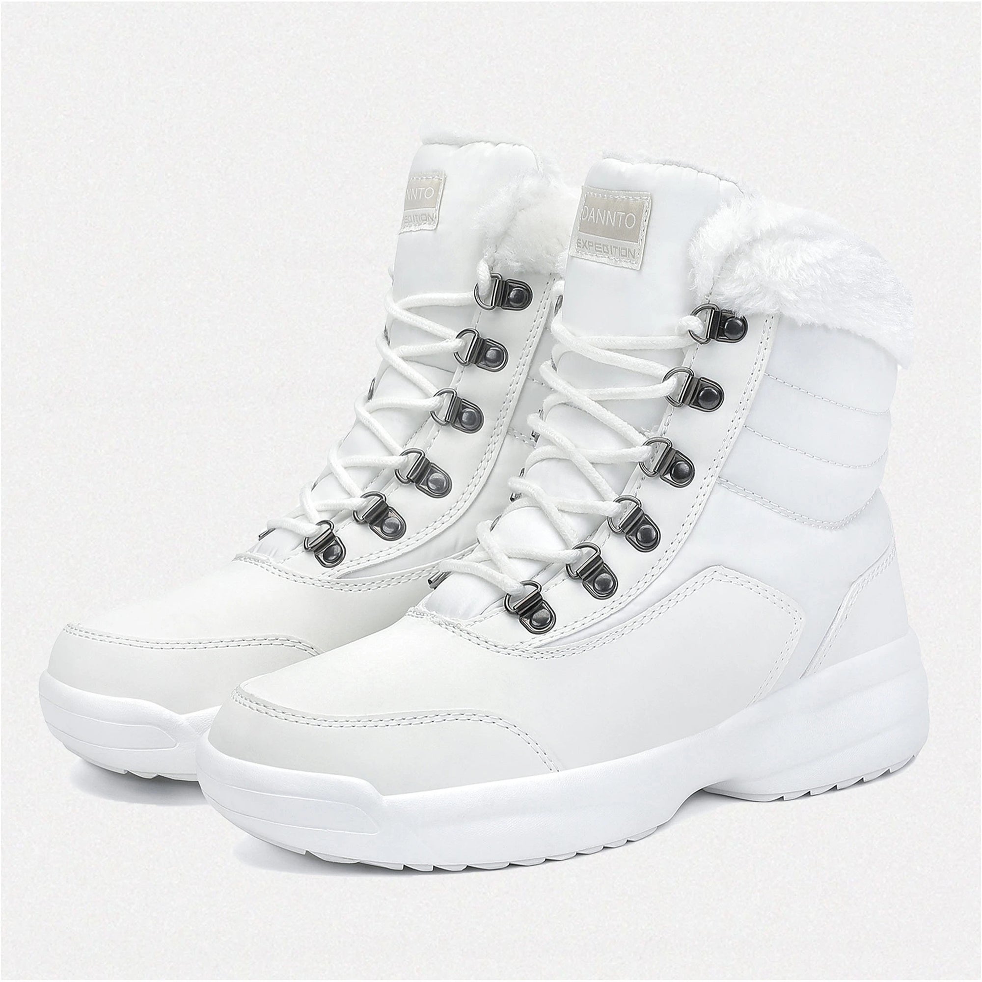 two Dannto women‘s w winter snow Boots shown at a side anglewhite